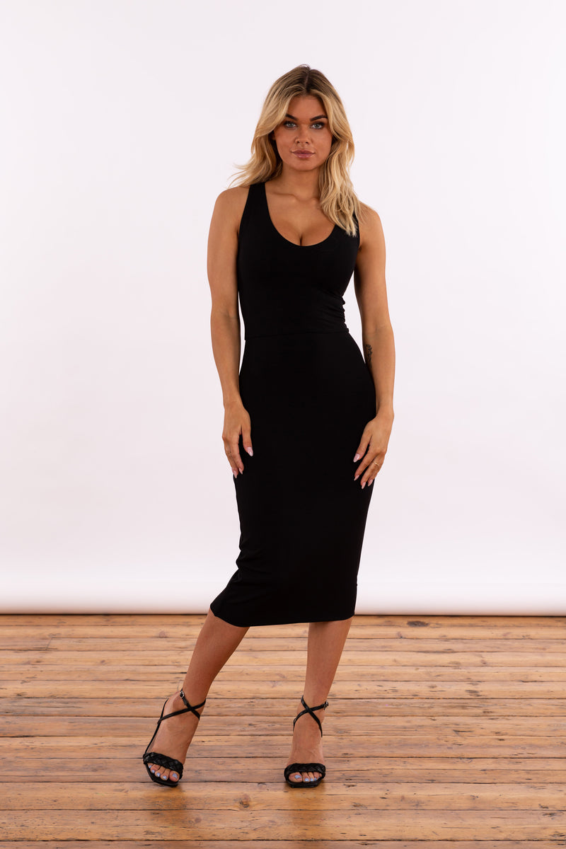 Model in black double layer bamboo midi dress with a reversible neckline