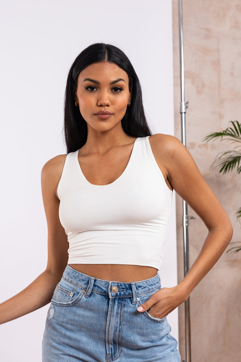 Model in ivory bamboo tank top with hidden support